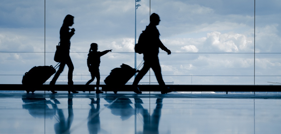 family-walking-through-airport family-walking-through-airport